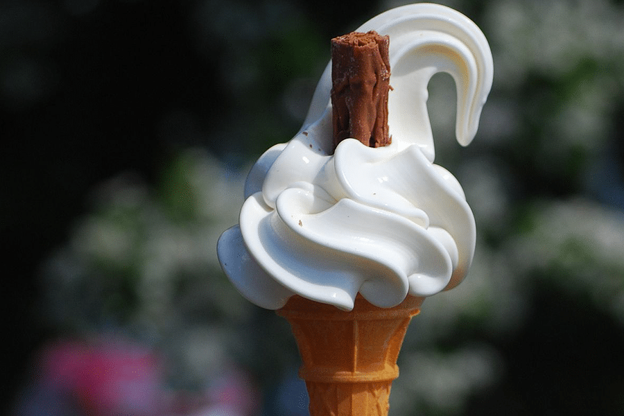 Happy customer receiving a soft serve cone at a Perth event
